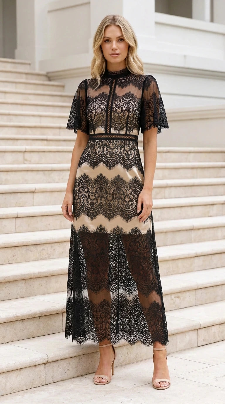 Full front view of black eyelash lace maxi dress with neutral nude lining