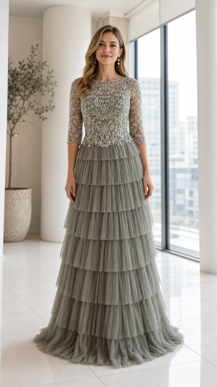 Front view of model wearing Sage Green beaded bodice tiered tulle maxi dress