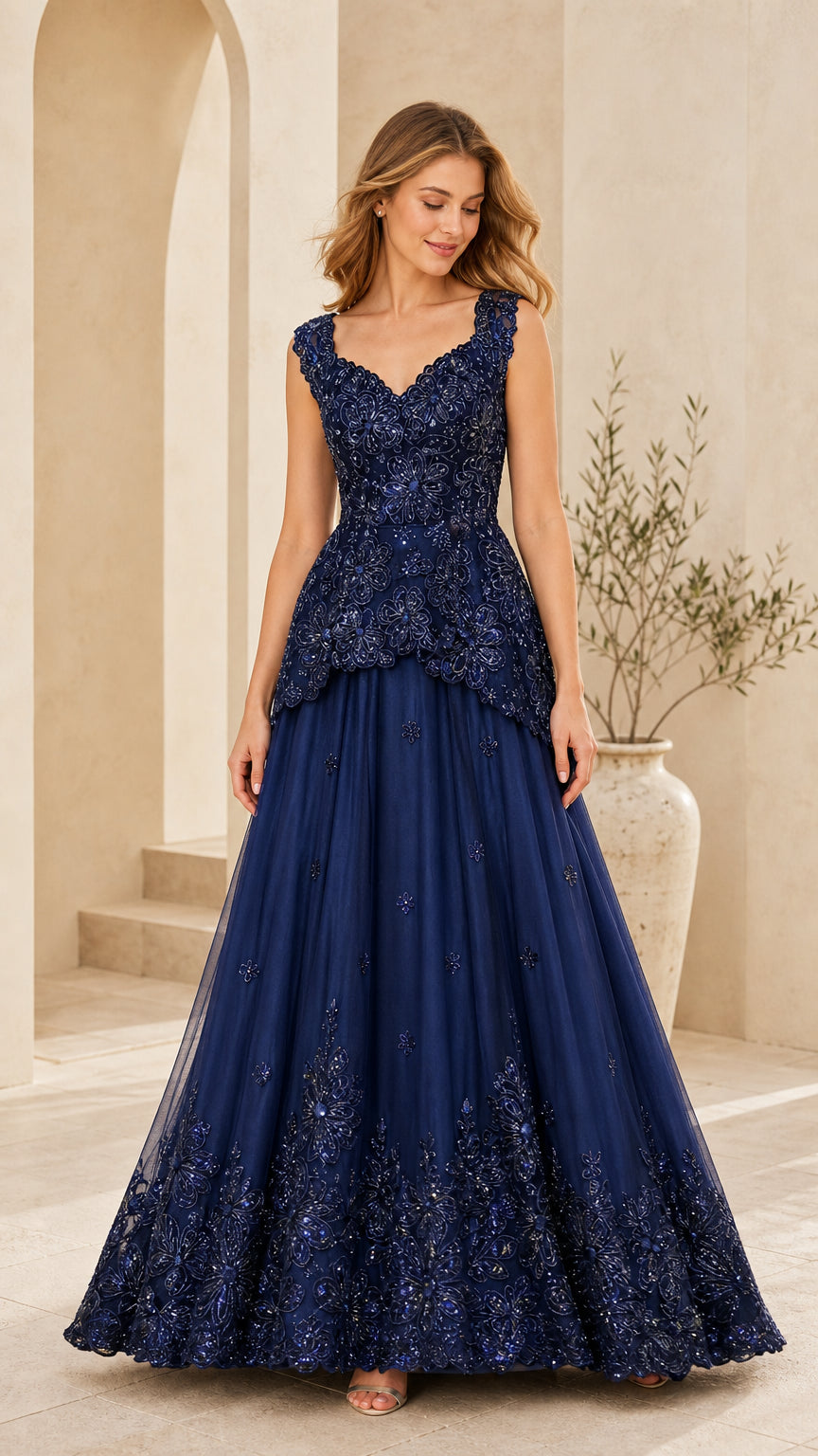 Front view of model wearing Navy Blue sequined floral peplum evening gown