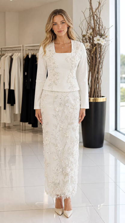 Front view of model wearing white square neck jacket and embroidered maxi skirt two-piece set