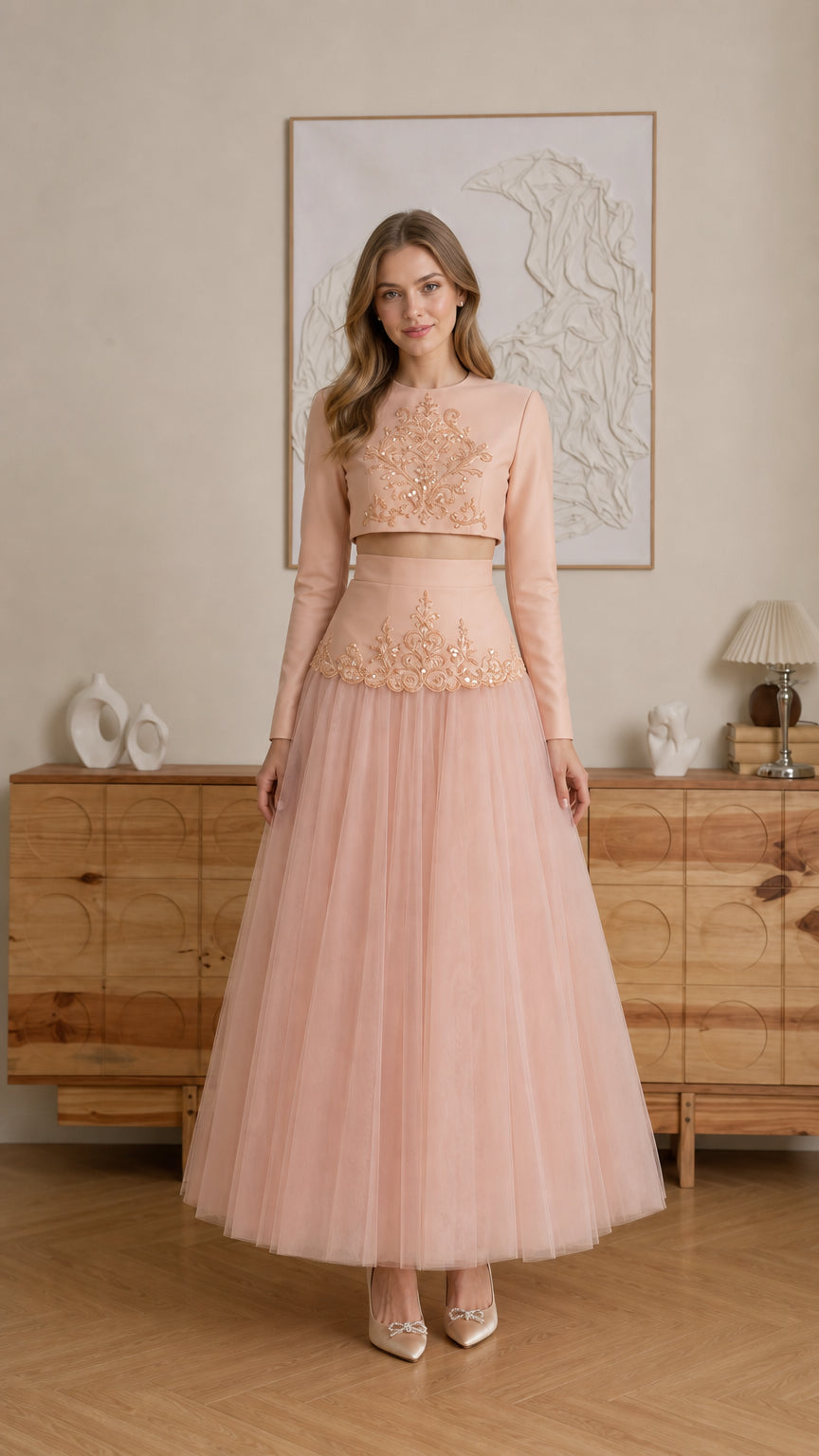Model wearing Blush Pink embroidered long-sleeve crop top and tulle maxi skirt two-piece set - front view
