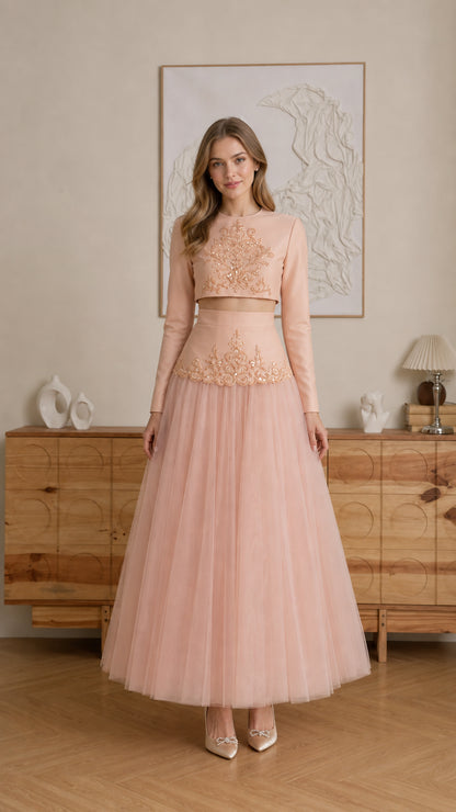 Model wearing Blush Pink embroidered long-sleeve crop top and tulle maxi skirt two-piece set - front view