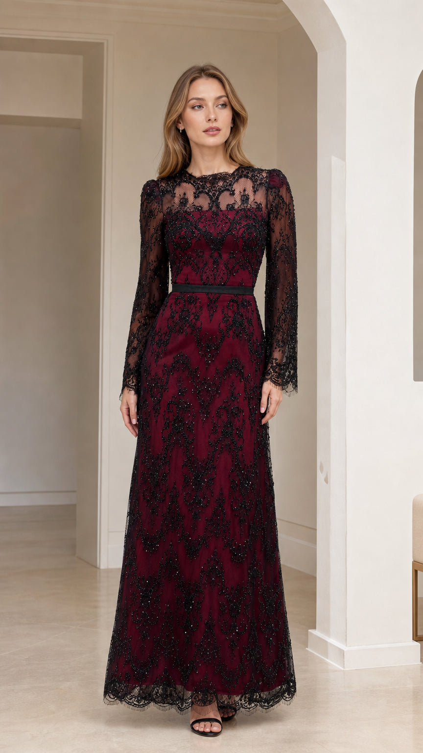 Front full-length view of model in burgundy long sleeve sequin lace evening maxi dress