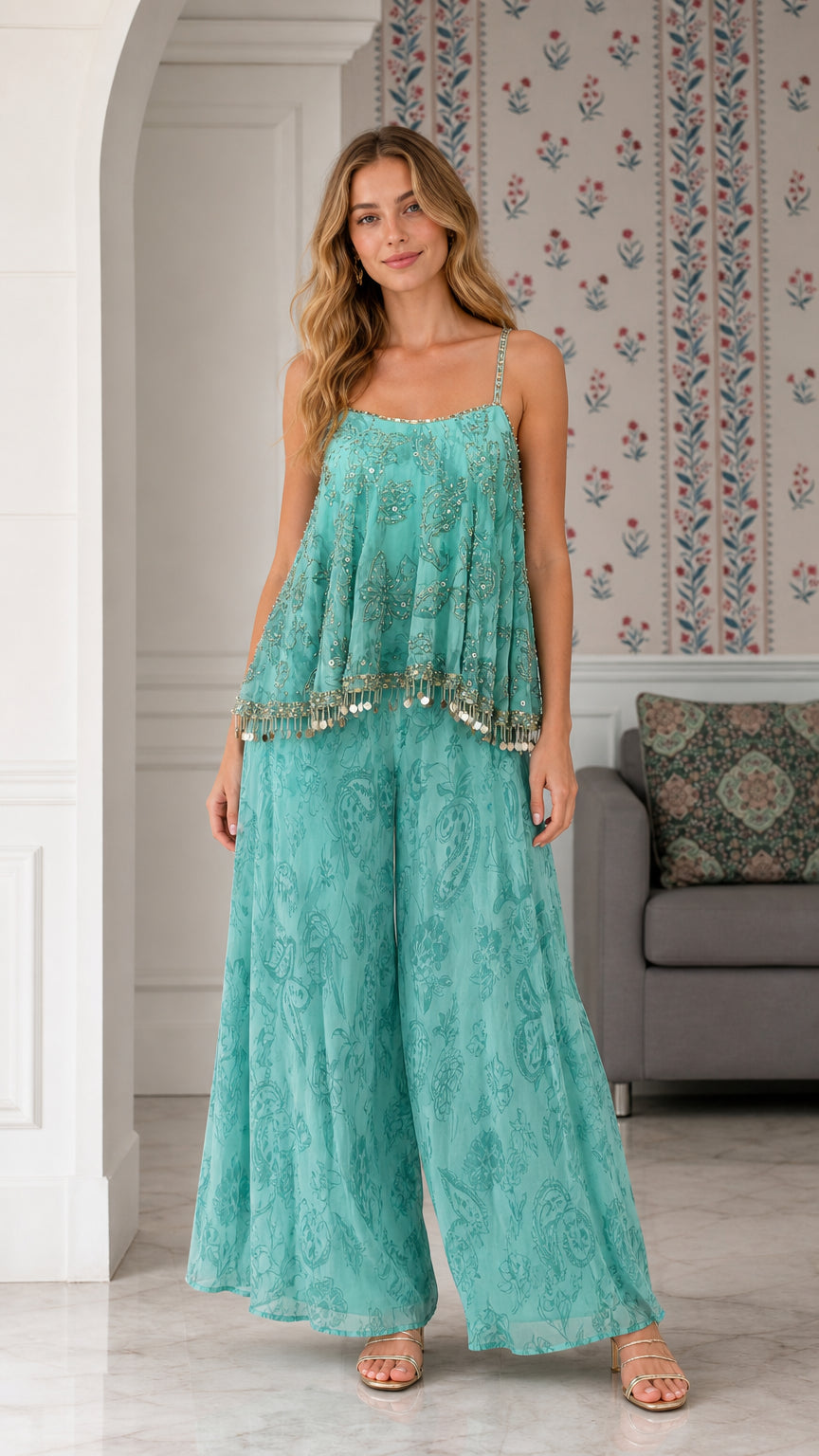 Model wearing turquoise sequin embroidered cami top and wide leg palazzo pants set front view