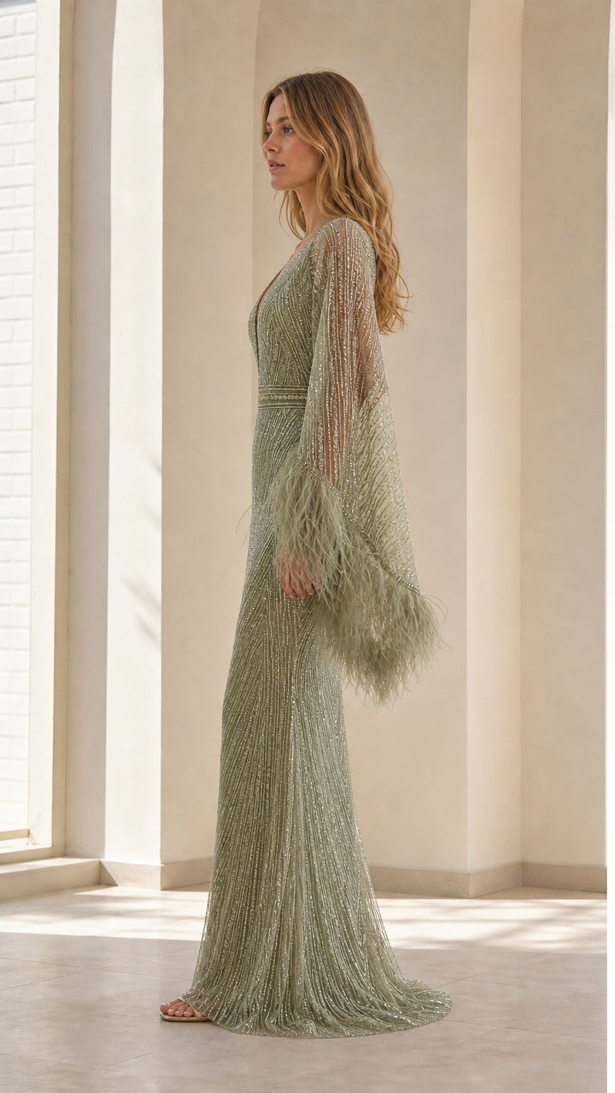 Side profile of sage green sequined evening dress showcasing mermaid silhouette and long sleeves