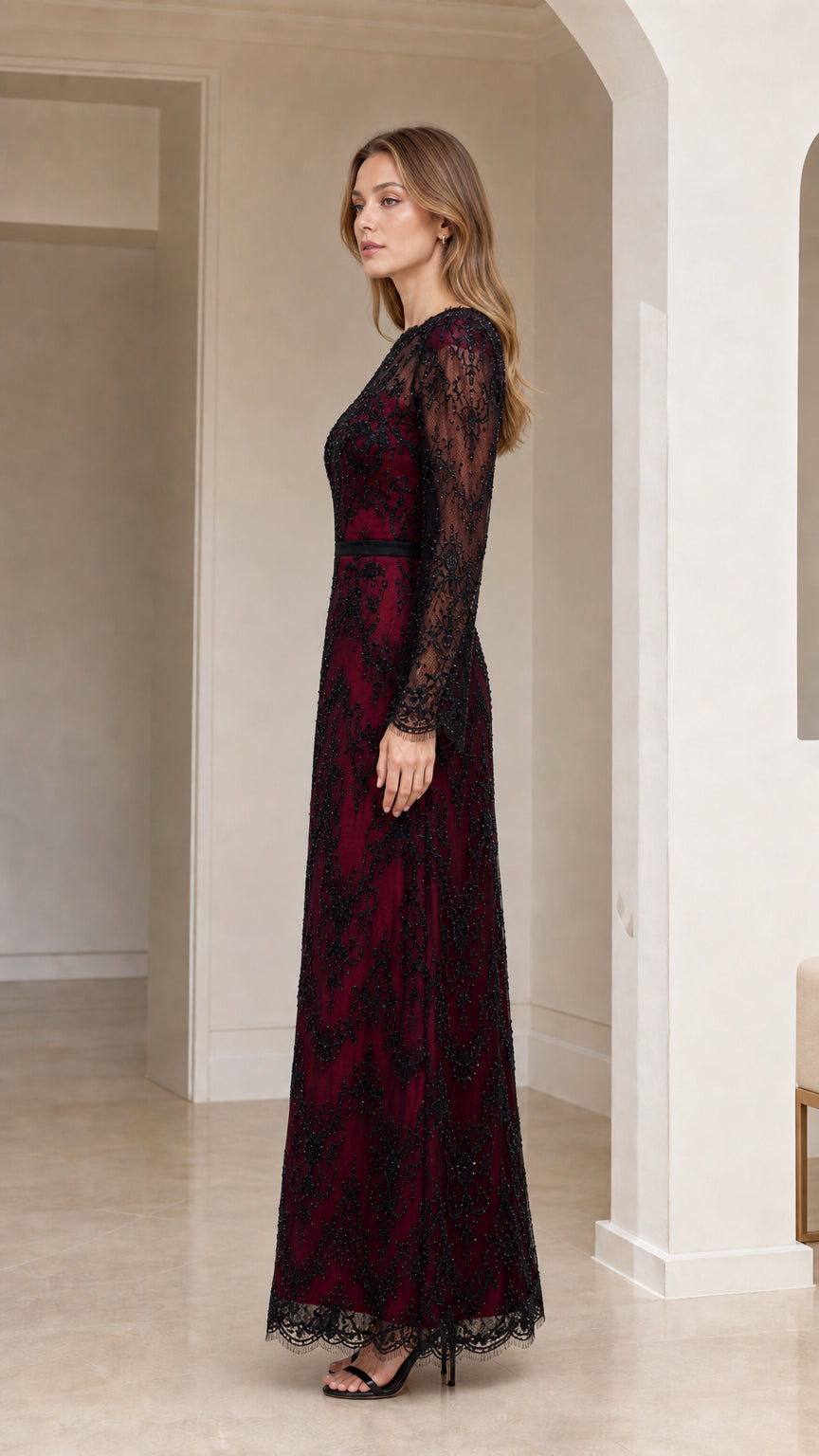 Side profile view of model wearing burgundy sequin lace evening gown