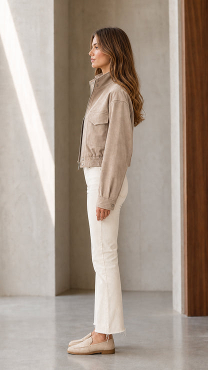 Side profile view of model wearing Khaki cropped utility jacket and flared trousers