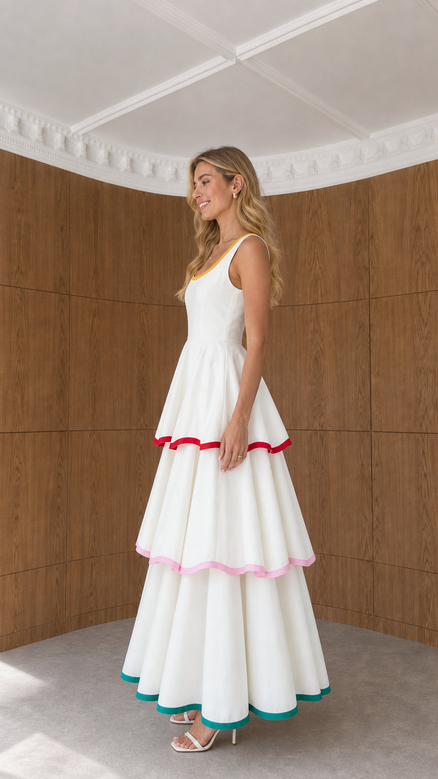 Side-angle view of model in white contrast trim tiered maxi dress