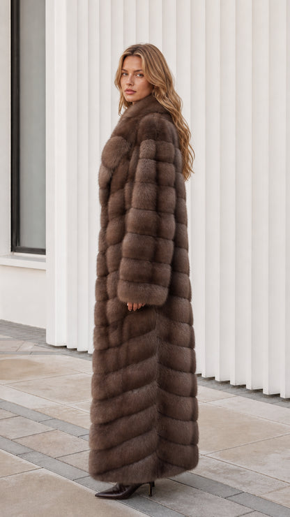 Side profile view of model wearing longline mocha brown plush faux fur coat