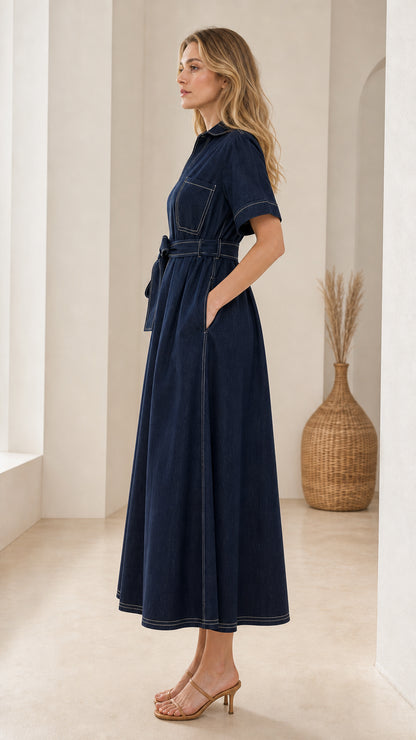 Side view of woman wearing dark blue belted midi shirt dress showing side pocket