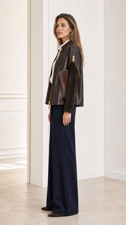 Side profile view of woman modeling the Dark Brown faux leather jacket