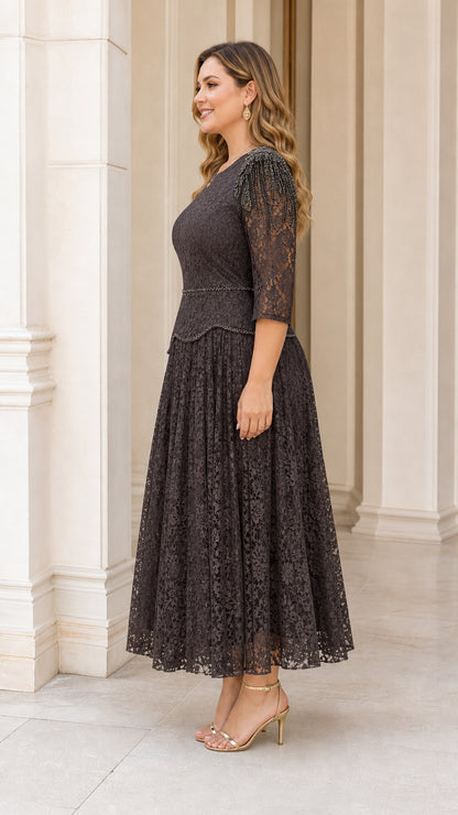 Side profile view of plus size dark charcoal lace dress