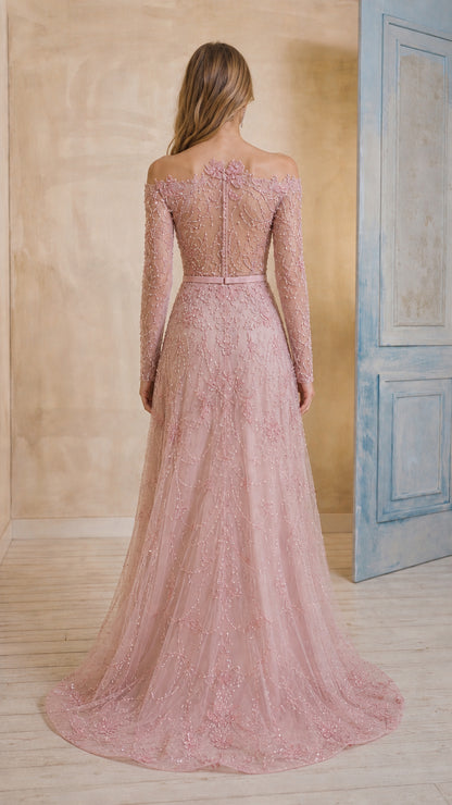 Back view of blush pink long sleeve formal evening gown with sweep train