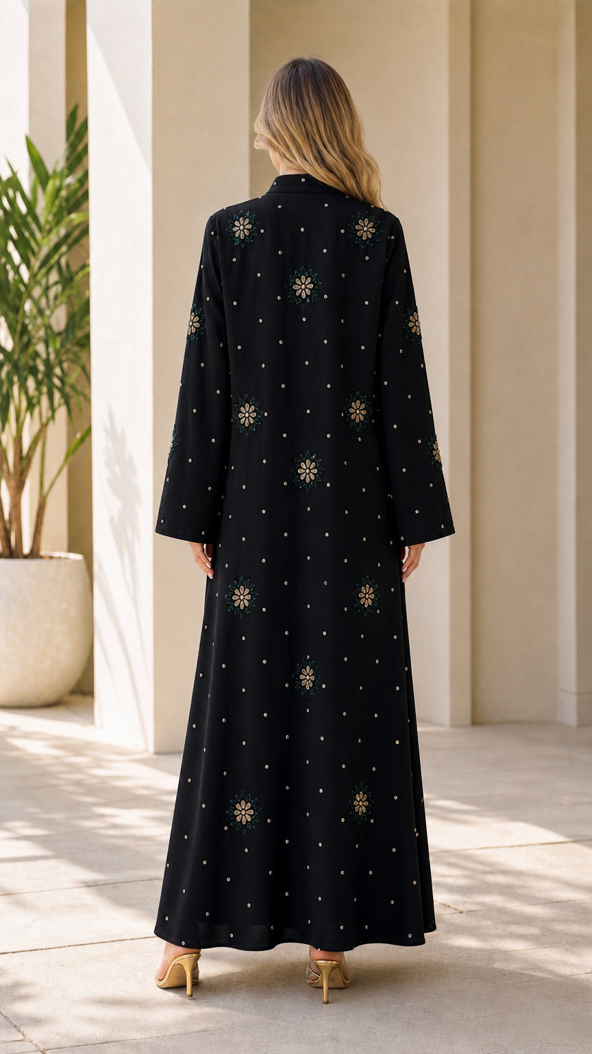 Back view of black long-sleeve modest dress with scattered rhinestone details