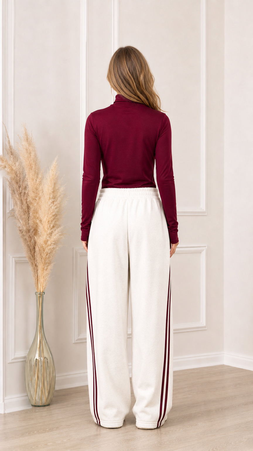 Back view of off-white wide-leg sweatpants with elastic waistband