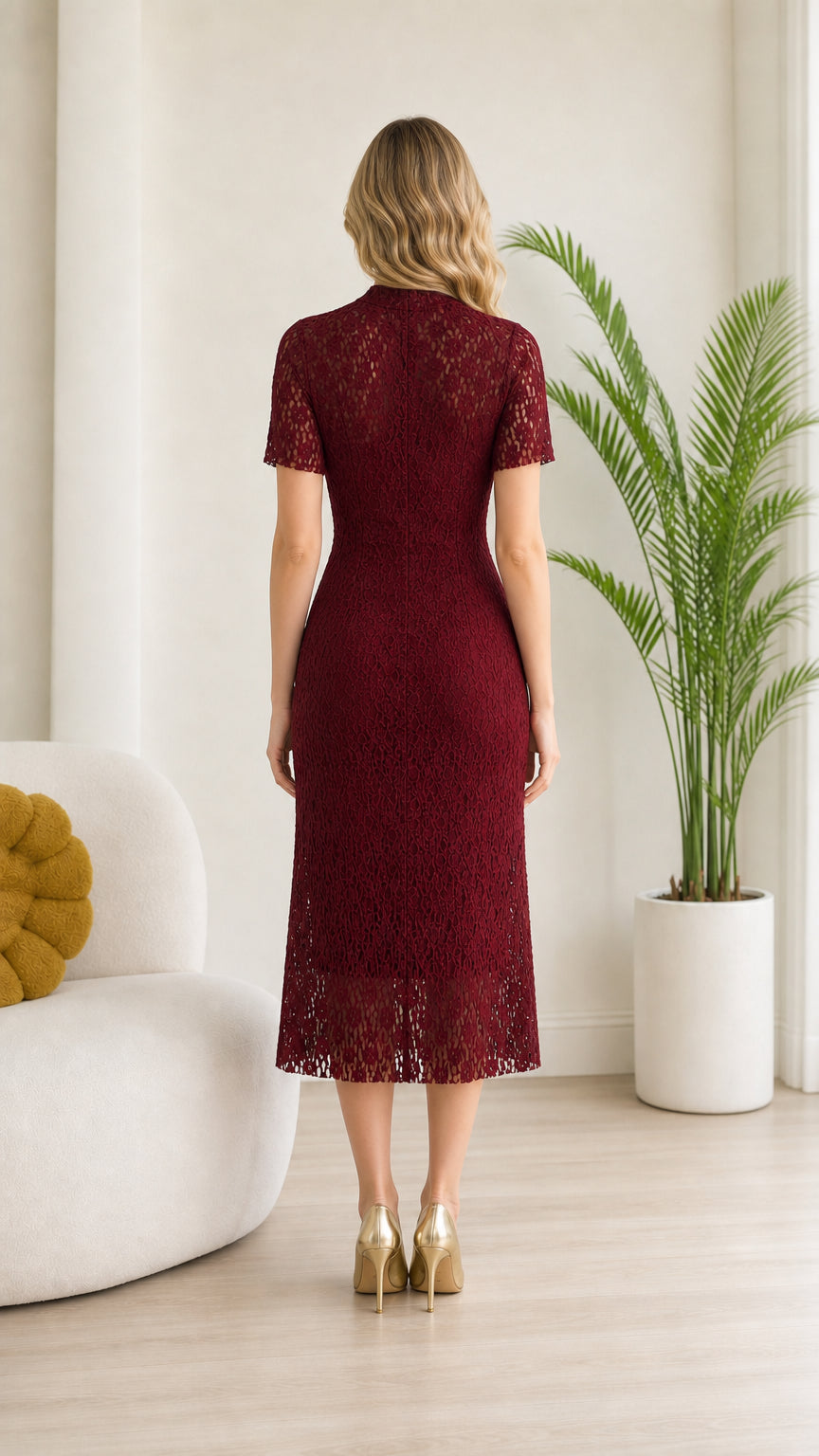 Back view of model in Burgundy midi lace dress showing zipper and fit