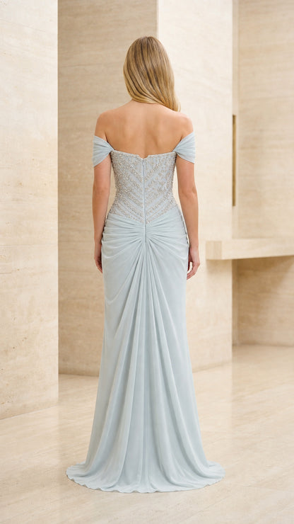 Back view of model in ice blue beaded off-the-shoulder evening gown