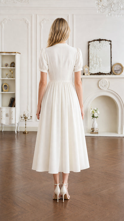 Back view of ivory A-line midi dress with short puff sleeves