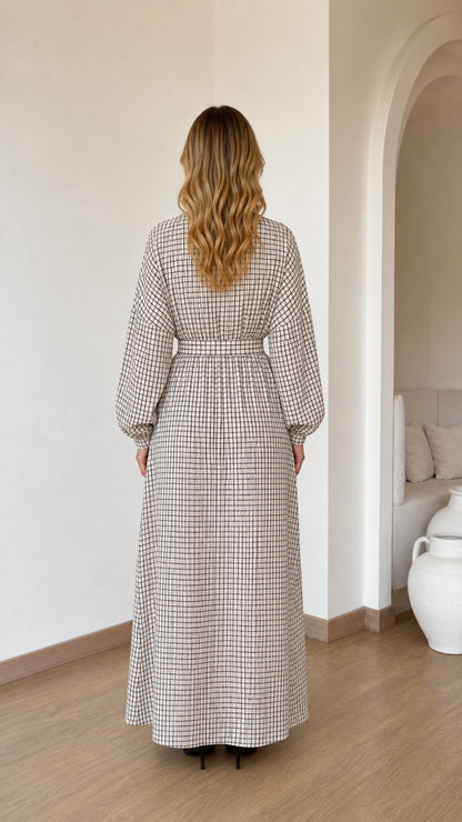 Back view of woman wearing Cream plaid full length maxi dress