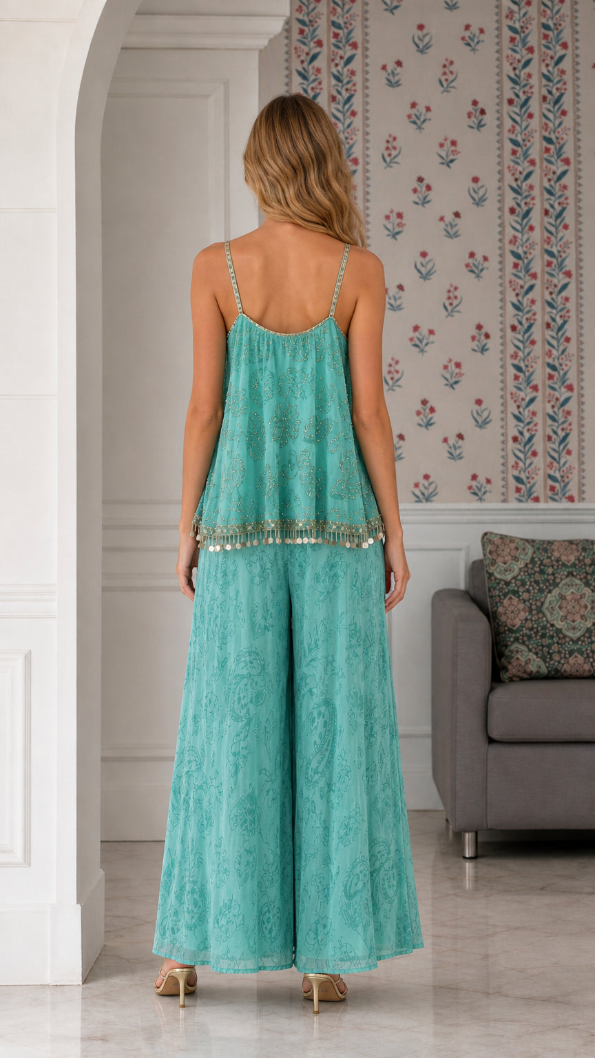 Back view of turquoise tiered cami and wide leg pants set showing draped silhouette