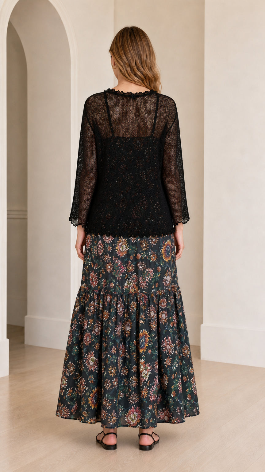 Back view of the black floral maxi dress with sheer long-sleeve overlay