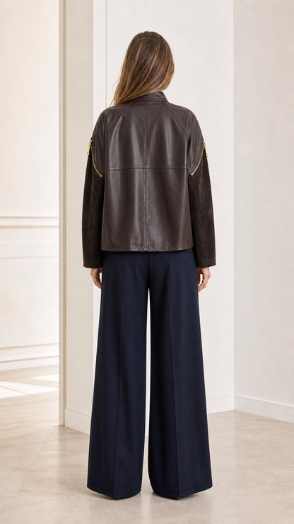 Back view of woman wearing the Dark Brown faux leather jacket