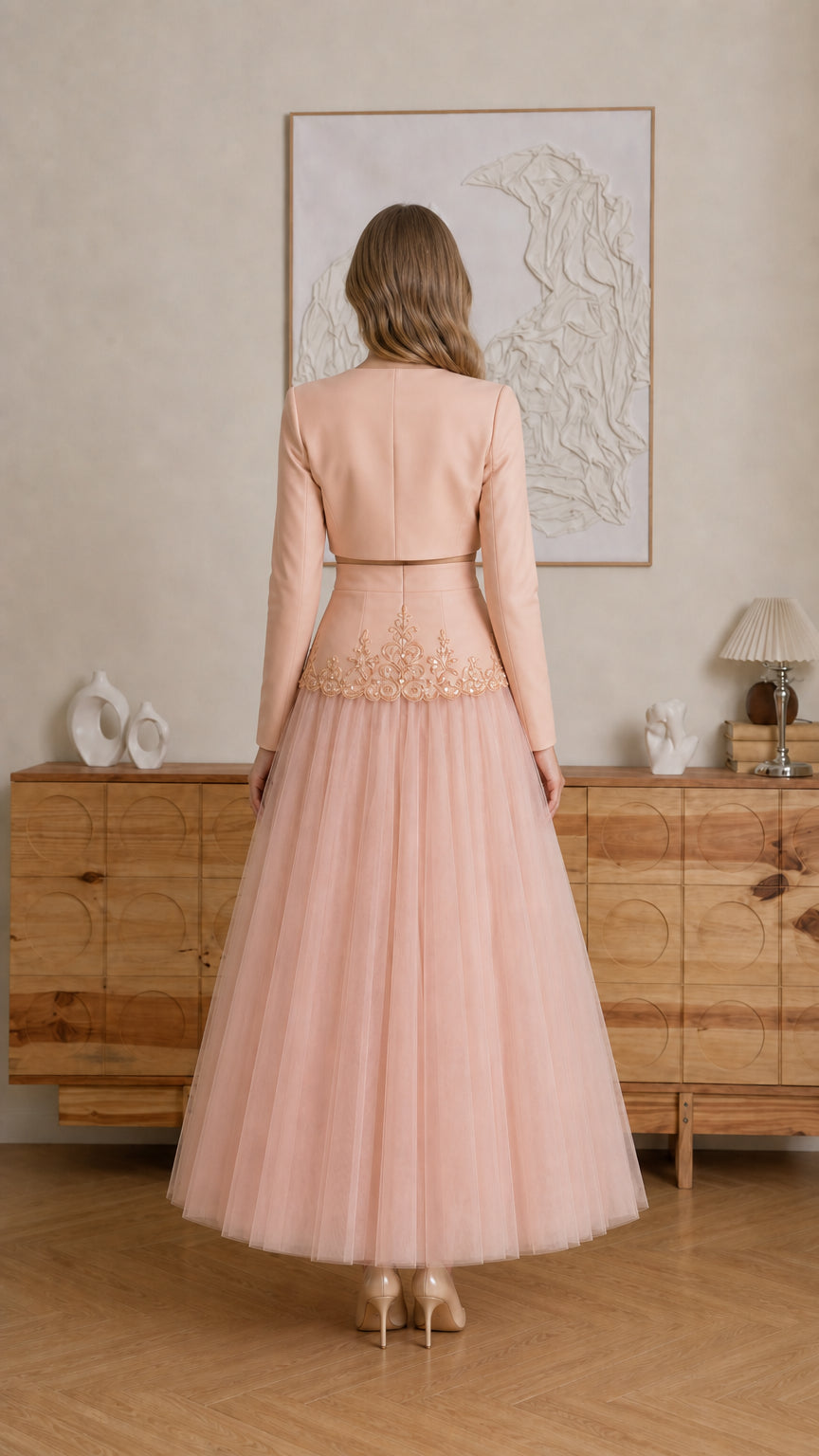 Model wearing Blush Pink long-sleeve crop top and tulle skirt - back view