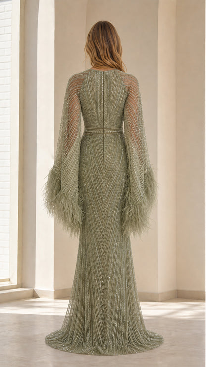 Back view of sage green sequin gown with hidden zipper closure and floor-length skirt