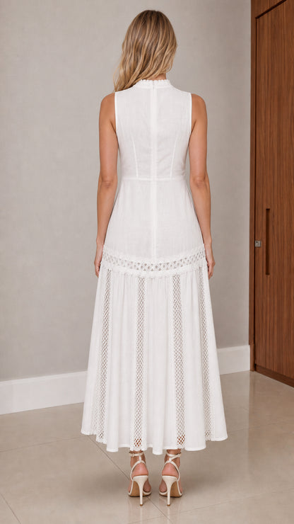Back view of model wearing white sleeveless A-line lace insert maxi dress