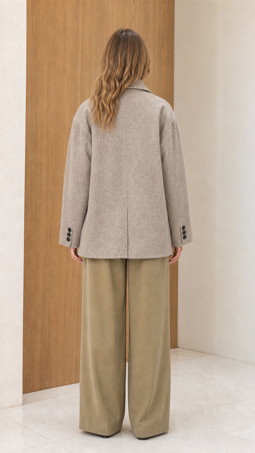 Back view of women's oatmeal heather peacoat displaying clean tailored silhouette