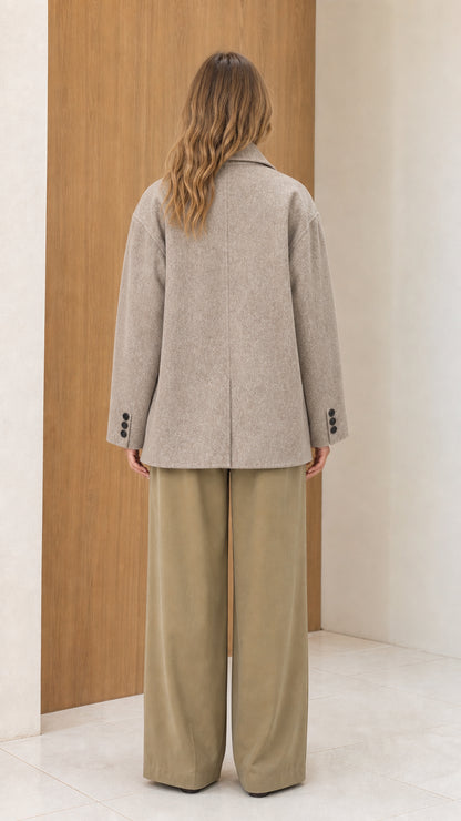Back view of women's oatmeal heather peacoat displaying clean tailored silhouette