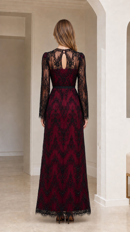 Back view of model showing keyhole back detail on burgundy lace evening maxi dress