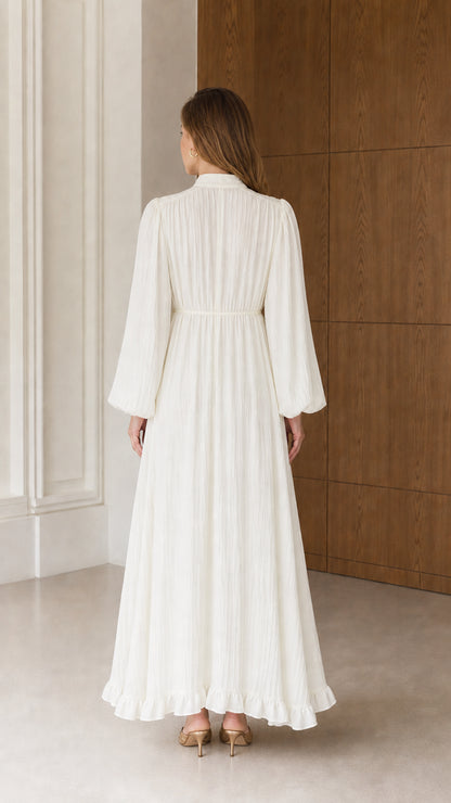 Back view of the Cream White long sleeve maxi dress highlighting full-length coverage and gathered waistline