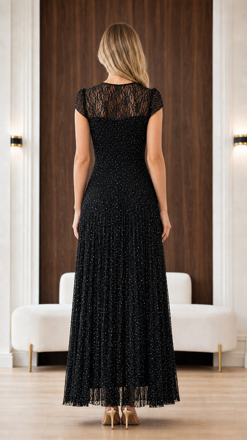Back view of black sheer lace back pleated formal dress