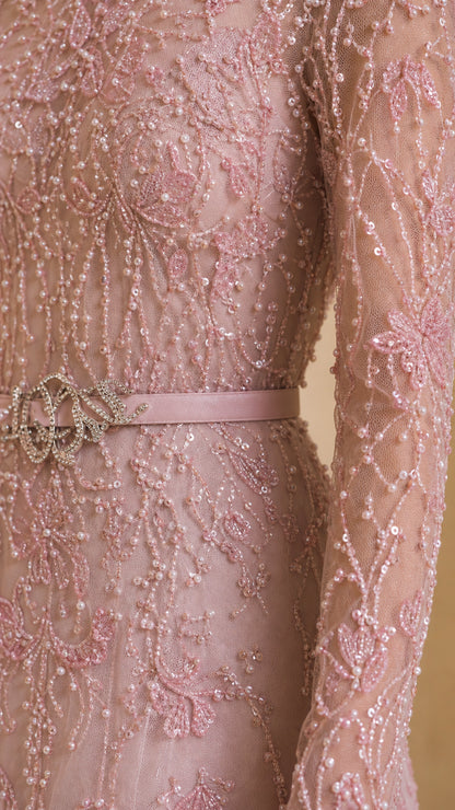 Close-up detail of blush pink sequin lace fabric and embellished waist belt
