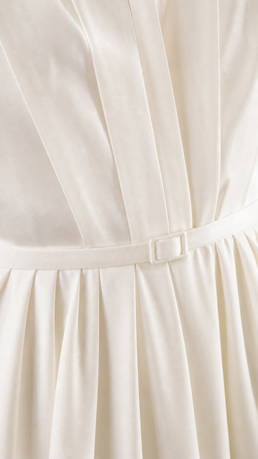 Close-up detail of bodice pleating and waist belt on ivory midi dress