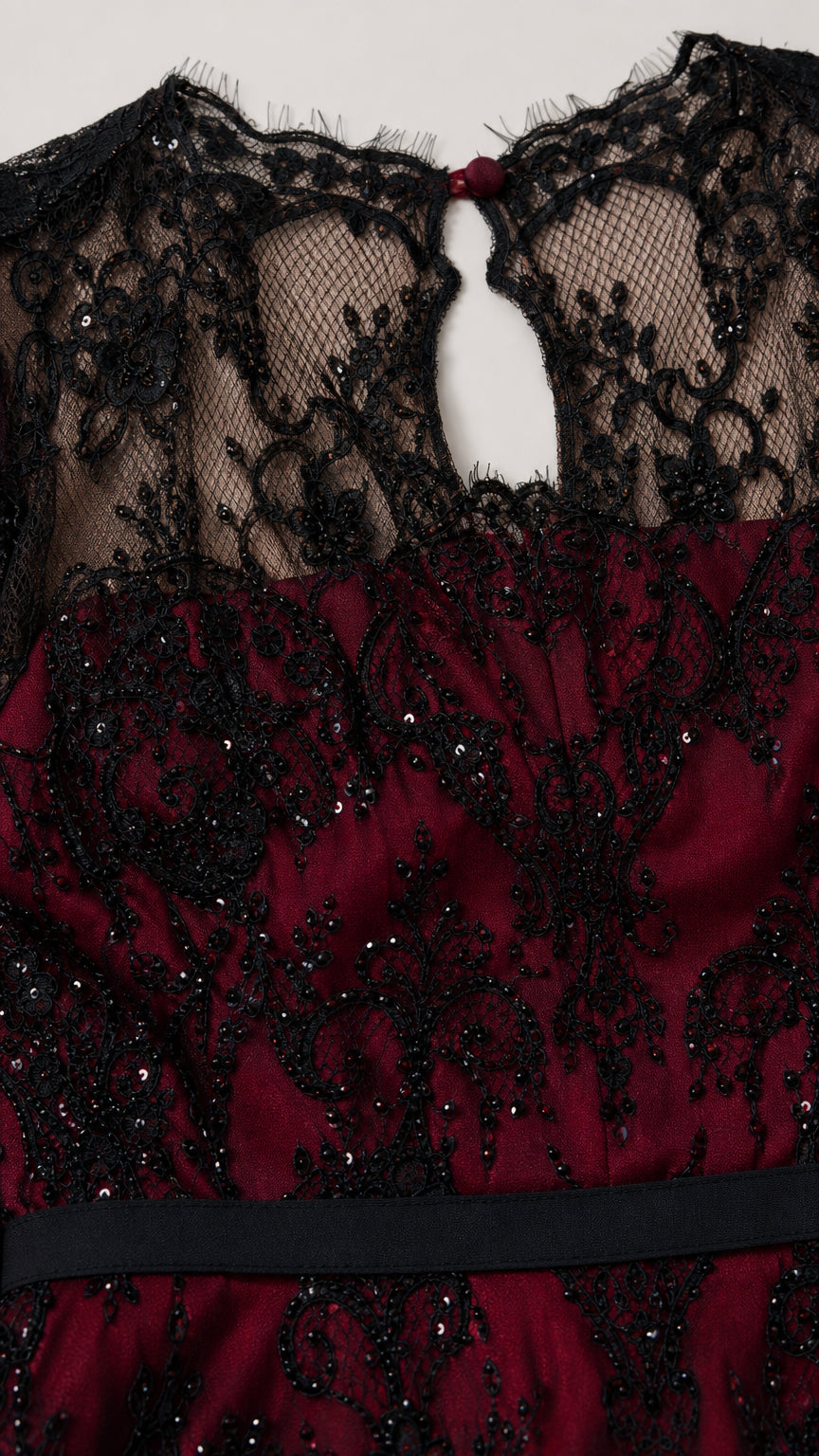 Close-up detail of black sequin lace bodice, illusion neckline, and keyhole back