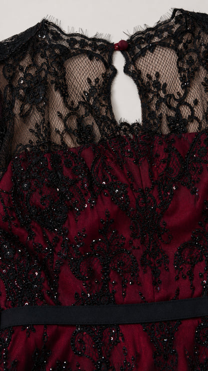 Close-up detail of black sequin lace bodice, illusion neckline, and keyhole back