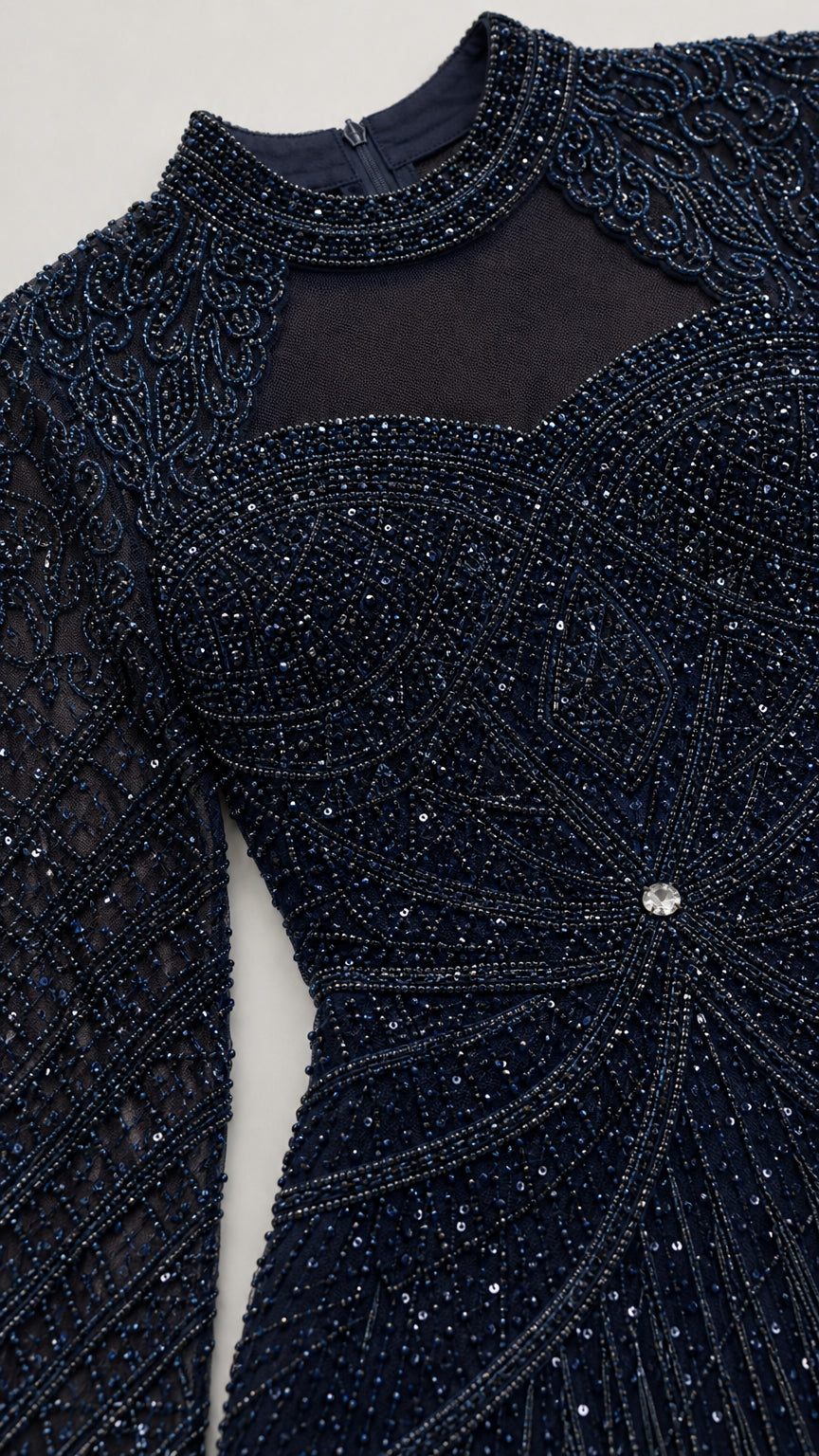 Close-up detail of sheer illusion neckline and intricate navy beadwork
