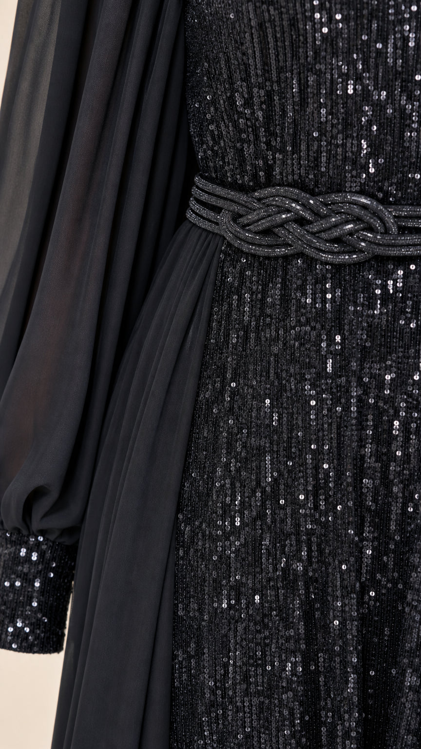 Close-up of black sequin texture, braided waistline detail, and sheer chiffon sleeve