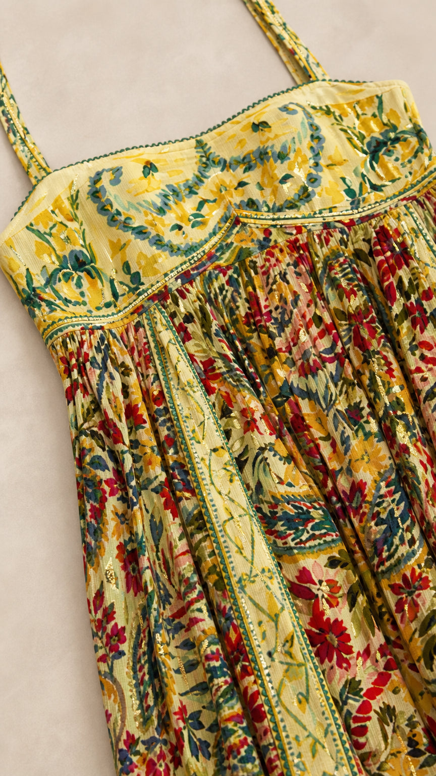 Close-up detail of yellow floral bodice with delicate trim and bust detailing