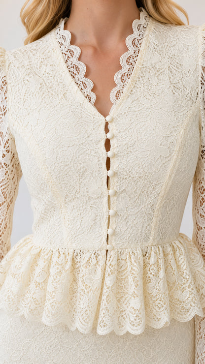 Close-up detail of scalloped V-neckline, buttons, and peplum waist in ivory lace