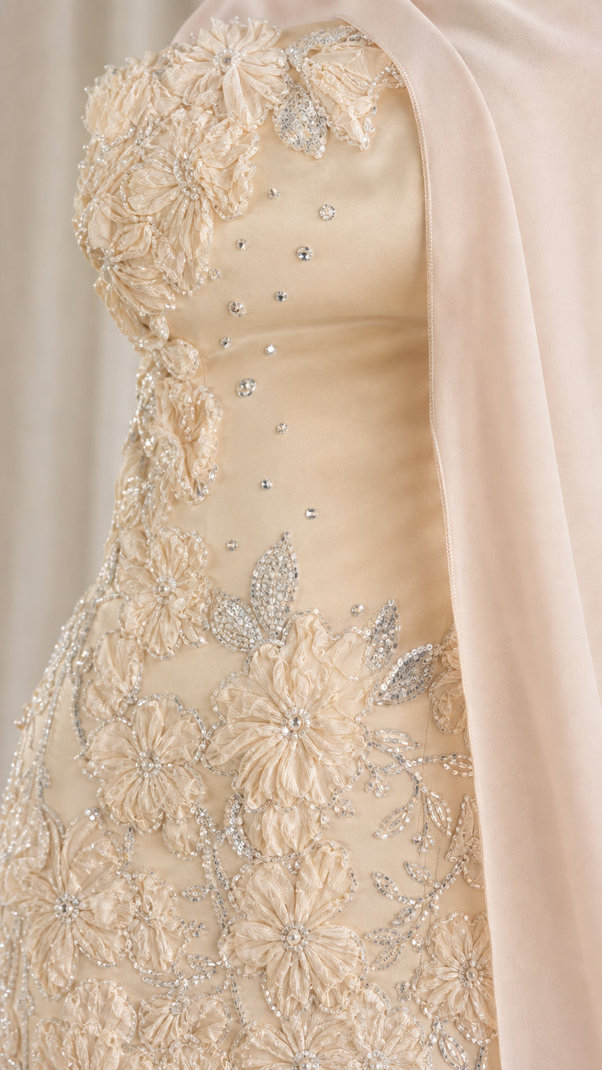 Close-up detail of champagne 3D floral lace embroidery and delicate beaded accents