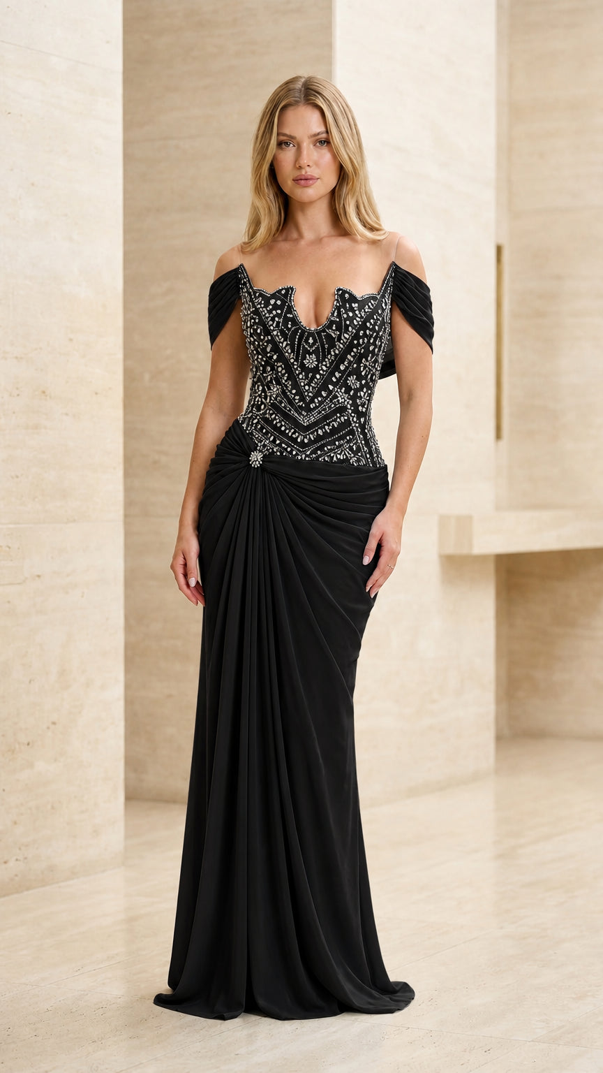 Model wearing black beaded off-the-shoulder formal evening dress