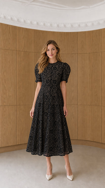 Full-length view of model wearing black floral lace puff sleeve midi dress