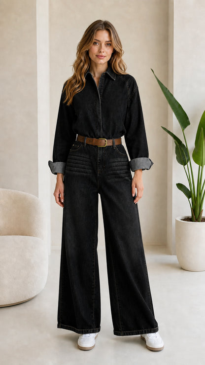 Woman wearing Washed Black wide leg long sleeve denim jumpsuit with belt