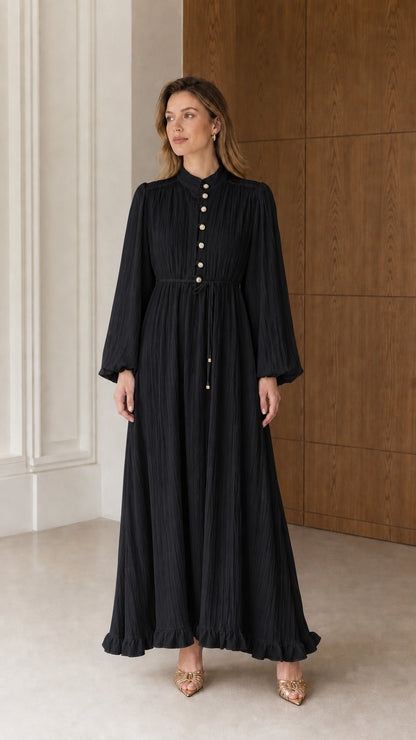 Full front view of the Classic Black long sleeve textured pleated maxi dress with tie waist