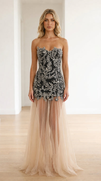 Black embroidered strapless corset gown with champagne sheer tulle skirt