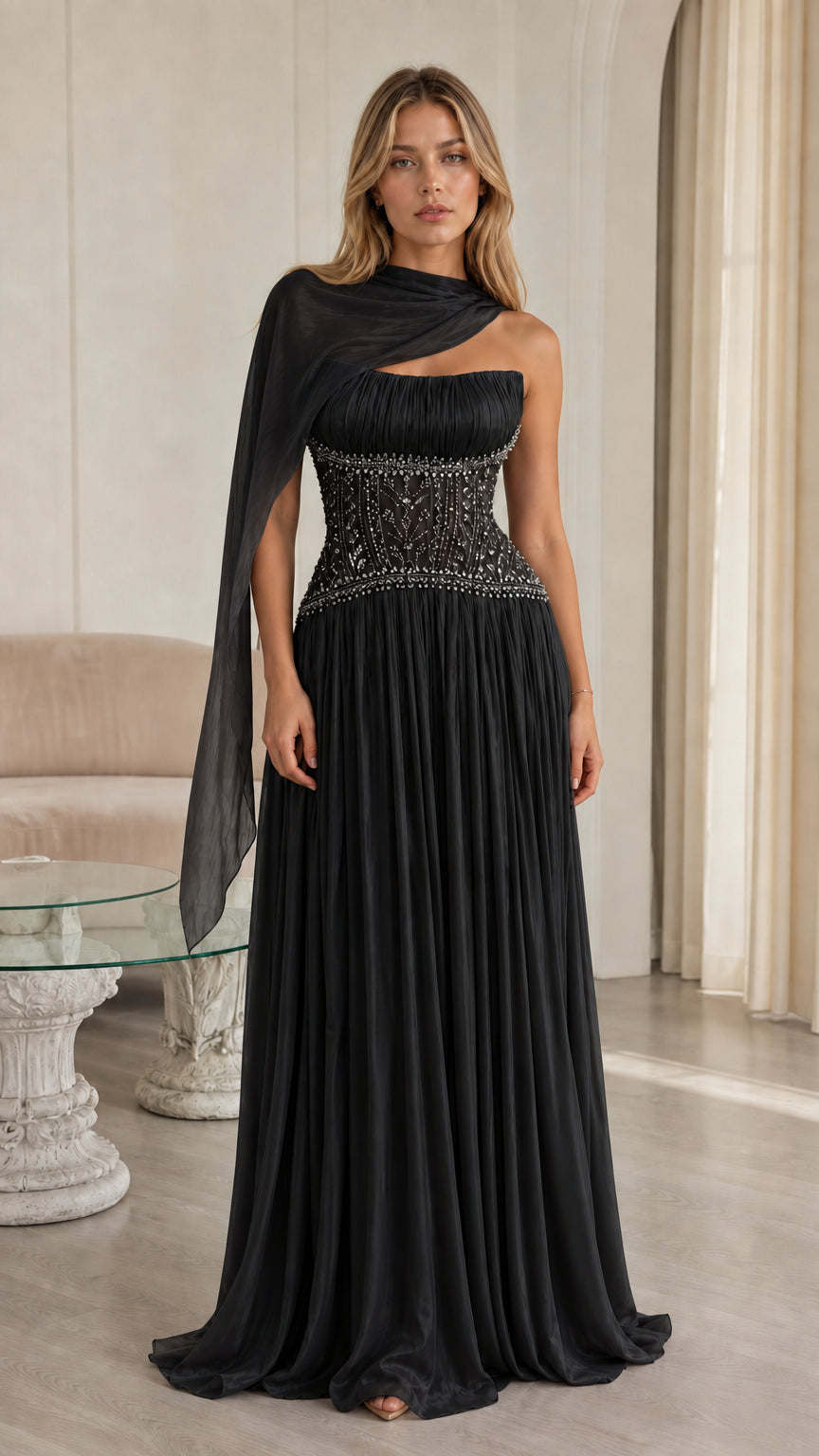 Front view of black pleated chiffon evening gown with beaded corset waist and drape