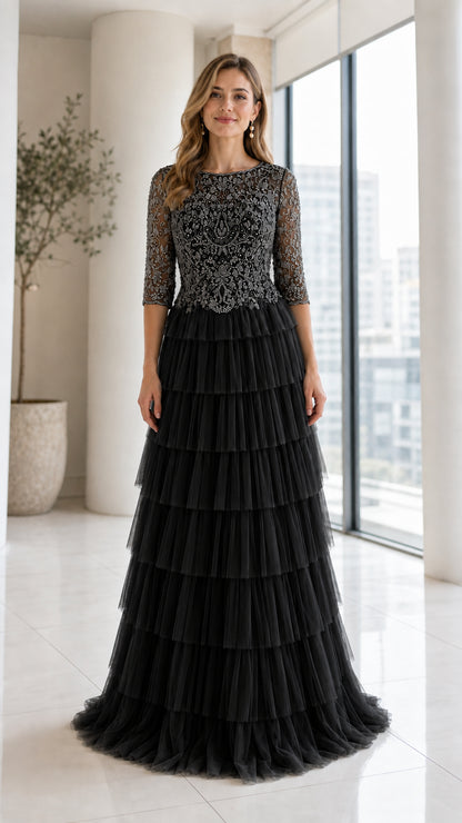 Front view of model wearing Black beaded bodice tiered tulle evening gown